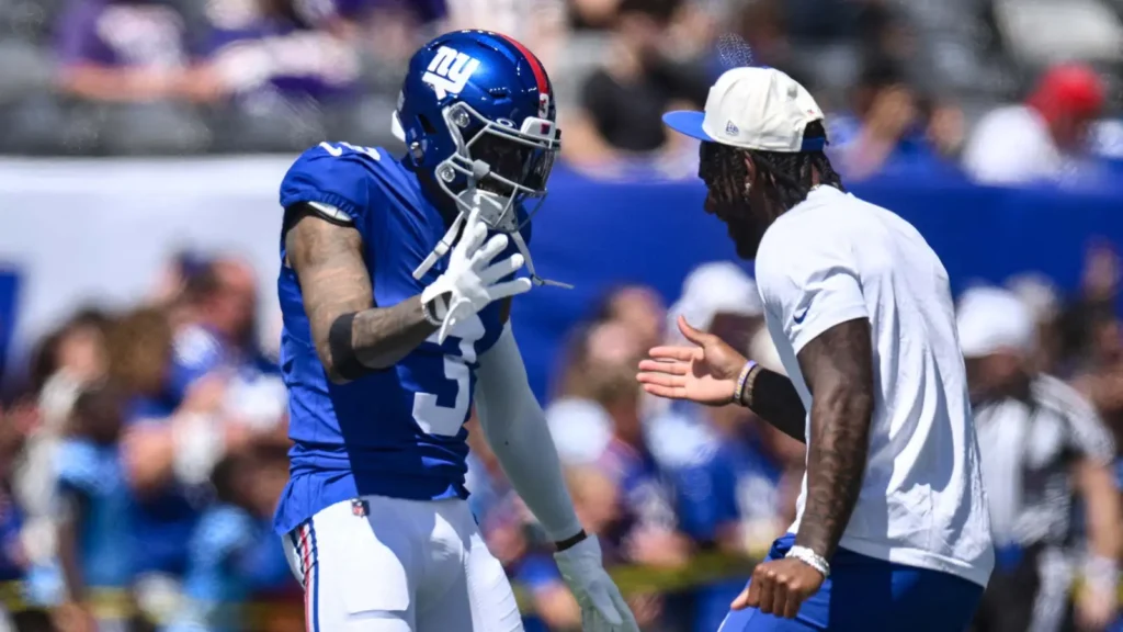 Aug 15, 2026; East Rutherford, New Jersey, USA; New York Giants wide receiver Odell Beckham Jr. (3) and wide receiver Malik Nabers (1) slap hands during warm up?